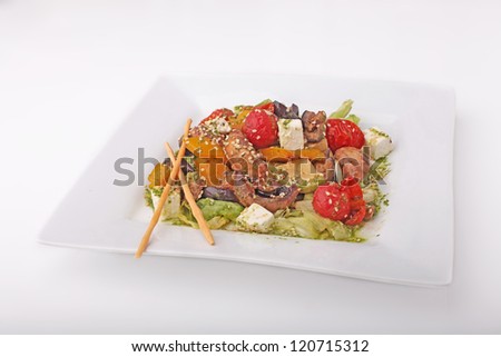 Salad with mushrooms and feta cheese and vegetable on isolated white background