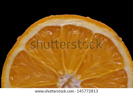 Orange slice against solid black/Orange Sunrise