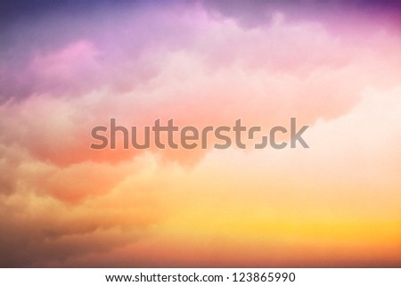 Clouds and fog with a colorful yellow to purple-blue gradient.  Image displays a pleasing paper texture visible at 100%.
