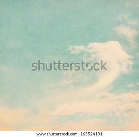 Clouds and fog on a textured, vintage paper background.  Image displays a pleasing grain texture at 100 percent.