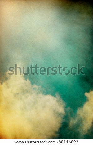 Sunlight shining through textured vintage clouds.  Image has a pleasing paper grain and texture at 100%.