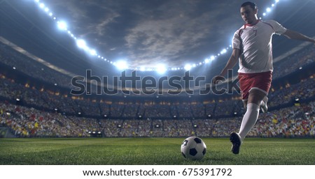 Soccer player kicks the ball with his feet during a soccer game on a professional outdoor soccer stadium. He wears unbranded soccer uniform. Stadium and crowd are made in 3D.