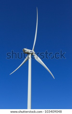 Elegant wind turbine generating clean, renewable energy.