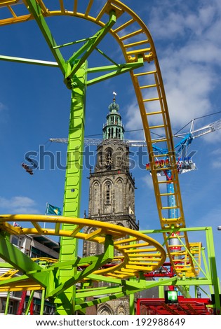 GRONINGEN - MAY 15: cool attractions and scary rides on a beautiful day at the fair ground on may 15 2014, Groningen, Netherlands.