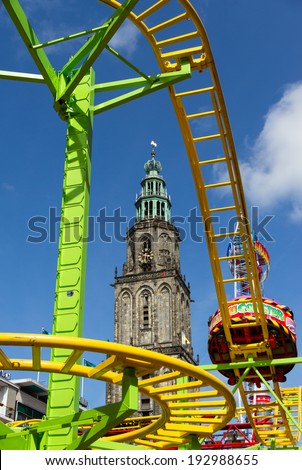 GRONINGEN - MAY 15: cool attractions and scary rides on a beautiful day at the fair ground on may 15 2014, Groningen, Netherlands.