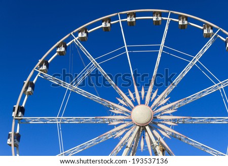 Ferris wheel on a beautiful day at the fair ground.