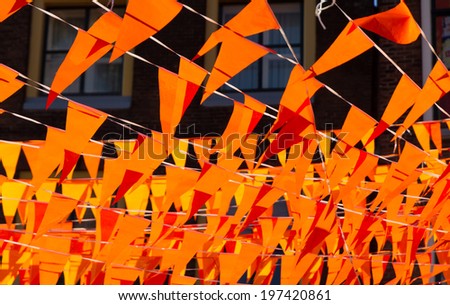 Orange flags during soccer world cup 2014. Flags and color also used at kings day in Holland.