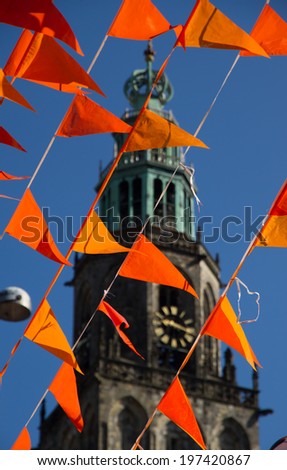 Orange flags (Dutch national color) and martinitoren during world soccer cup 2014. Flags also used on Kings day.