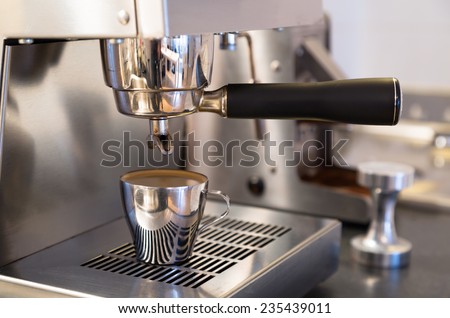 Making espresso on stainless steel home espresso machine.