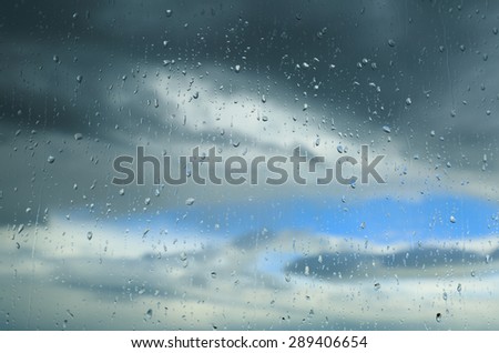 Raindrops on a window during bad weather.