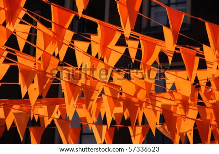 Orange flags during the world cup soccer. Flags and color also used at queens day in Holland.