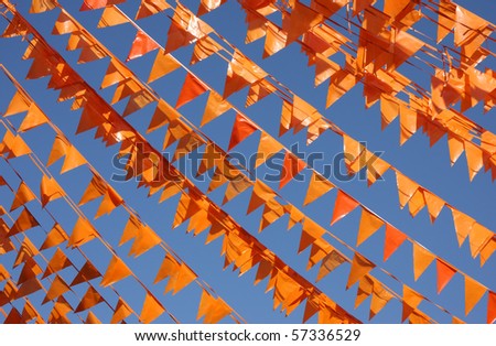 Flags in Dutch national color (orange) in the clear blue sky of Groningen, Holland