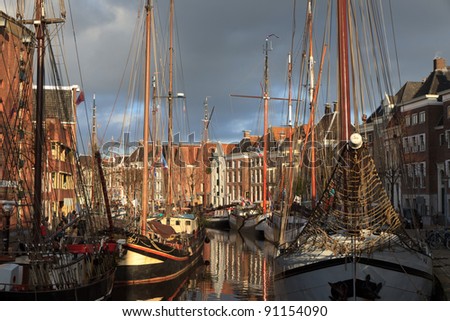Classic sailing ships at a sailing event in an old harbor in Holland.