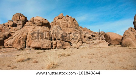 Red rocks in the barren sands of the Gobi Desert
