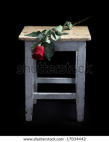 Flowers and old a stool on a white background