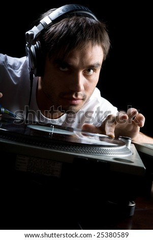 DJ plays set in a vinyl player