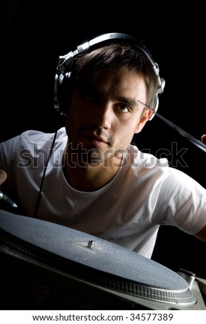 DJ plays set in a vinyl player