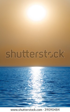 Sun or moon above the waves of the sea or ocean