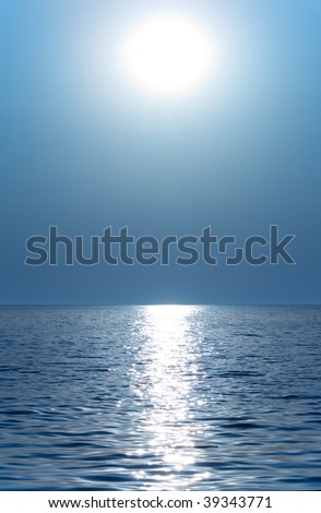 Sun or moon above the waves of the sea or ocean