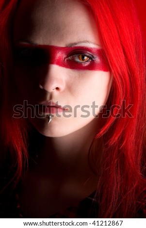 cat eyes hair. stock photo : A beautiful woman with cat#39;s eyes and red hair