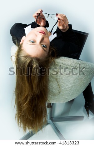A beautiful woman relaxing in an office chair