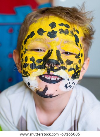 child with tiger face paint