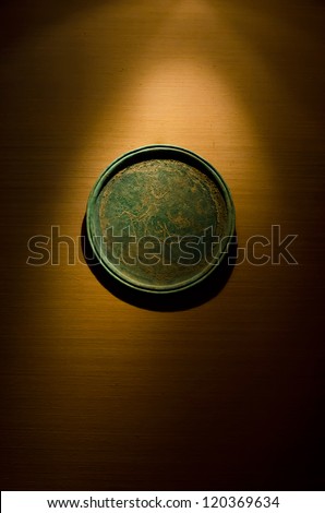 Antique circle object decorated on the wooden wall