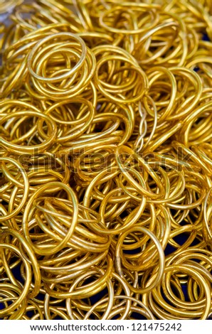Pile of gold bracelets in Thai market