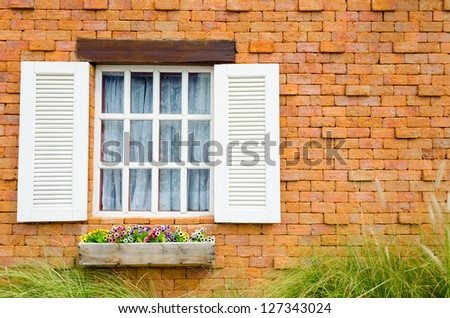 Old Brick Building with vintage and European style with flower porch in the front