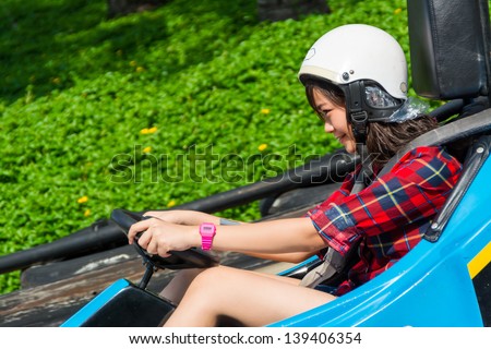 Cute Thai girl is driving Go-kart with speed