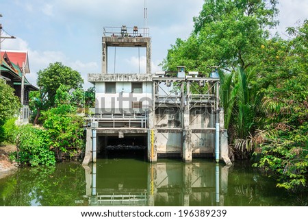 Water gate architecture in the rural canal of Thailand. It is use to release water at an appropriate level.