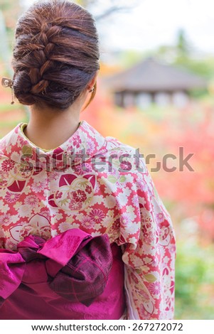 Back of a pretty Japanese girl in beautiful atmosphere. This picture has soft focus.