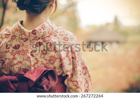 Back of a pretty Japanese girl in beautiful atmosphere in retro color. This picture has soft focus.