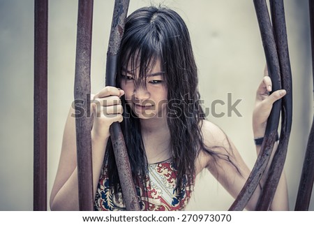 Asian Thai girl is bending the prison bar with her power