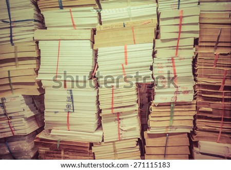 stack of old books and documents pile up together in retro color