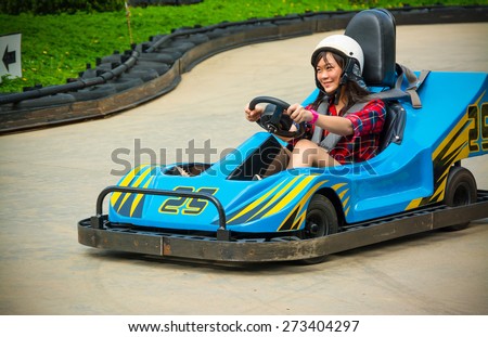 Cute Thai girl is driving Go-kart with speed