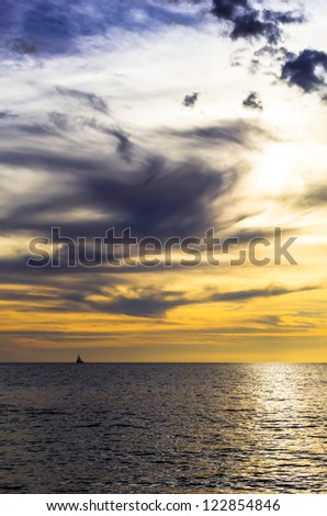 dramatic dark cloudy sunset over the ocean