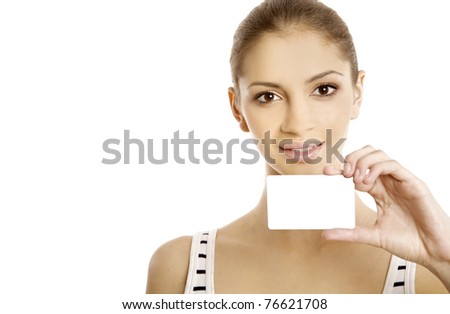 Attractive woman showing business card. Young female professional executive smiling in white suit - closeup and copy space of business card.