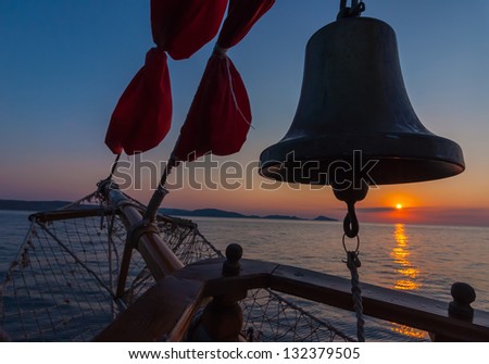Sailboat on the ocean at sunset