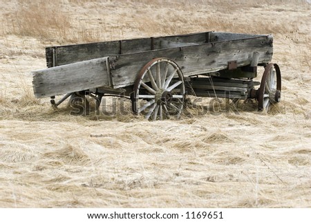 Abandoned wagon in field