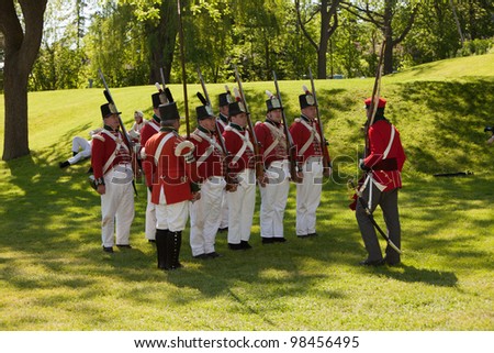 STONEY CREEK, ONTARIO, CANADA - JUNE 6 : Military inspection during a War of 1812 re-enactment at Stoney Creek Onatio Canada June 6, 2011