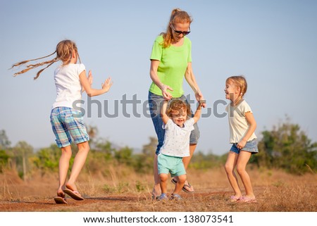 happy family dancing on the road