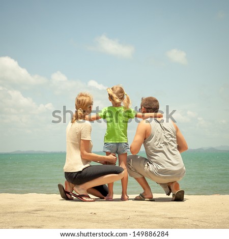 Happy family near the beach in the day time Happy family near the beach in the day time