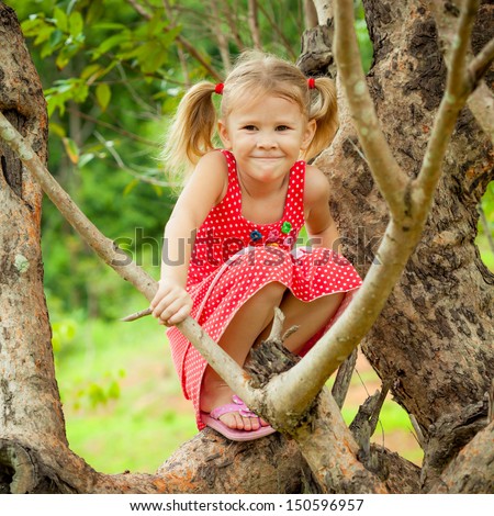 Little Girl Sitting On The Tree Stock Photo 150596957 : Shutterstock