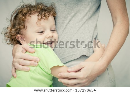 little boy hugging his mother