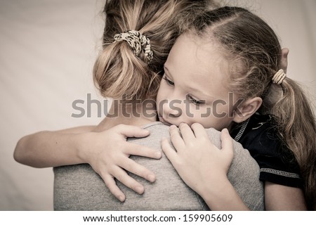 Sad Daughter Hugging His Mother