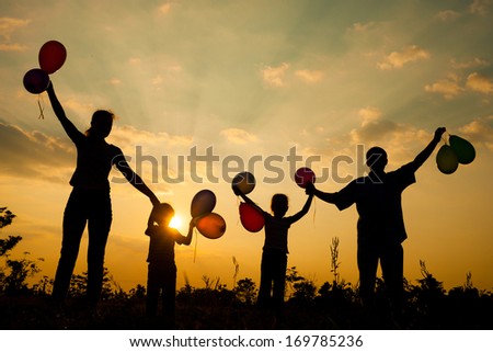 Happy Family Playing With Balloons On The Road In The Sunset Time. Evening Party On The Nature