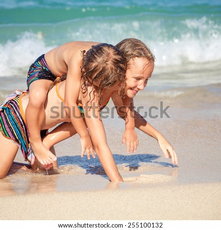 happy kids playing on beach at the day time. Concept Brother And Sister Together Forever