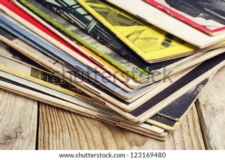 Old magazines on a wooden table
