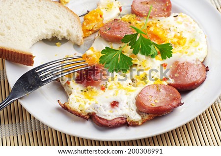 Delicious breakfast with scrambled eggs and sausage